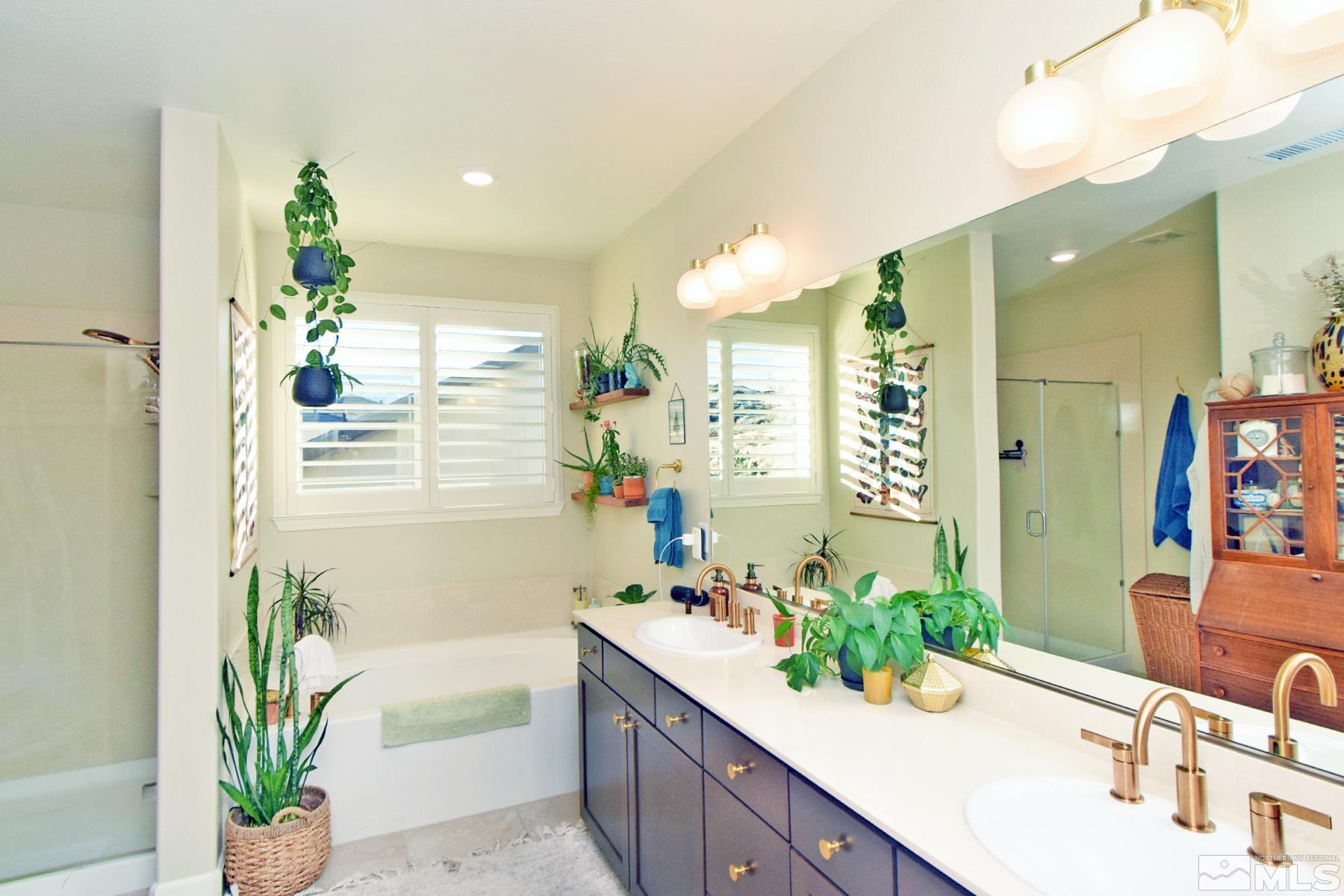 1630 Scott Valley Road Reno, NV 89523 - Photo 19 of 33 a bathroom with a bathtub sink and mirror
