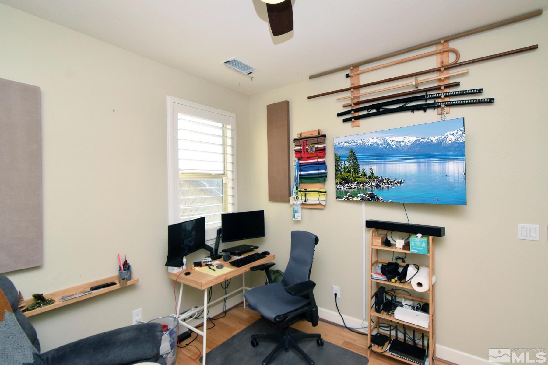 1630 Scott Valley Road Reno, NV 89523 - Photo 22 of 33 a view of a workspace with furniture and a window