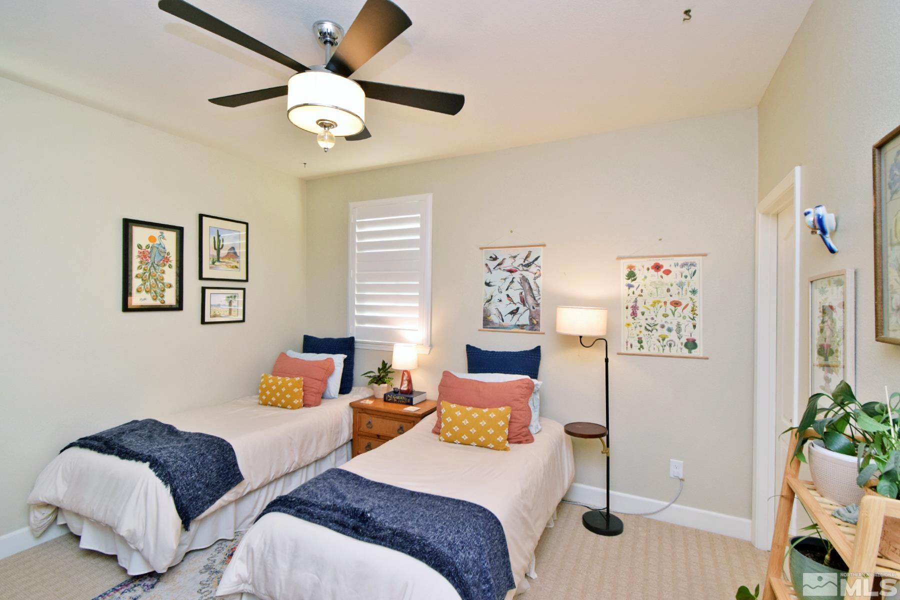 1630 Scott Valley Road Reno, NV 89523 - Photo 24 of 33 a bedroom with two beds and a chandelier