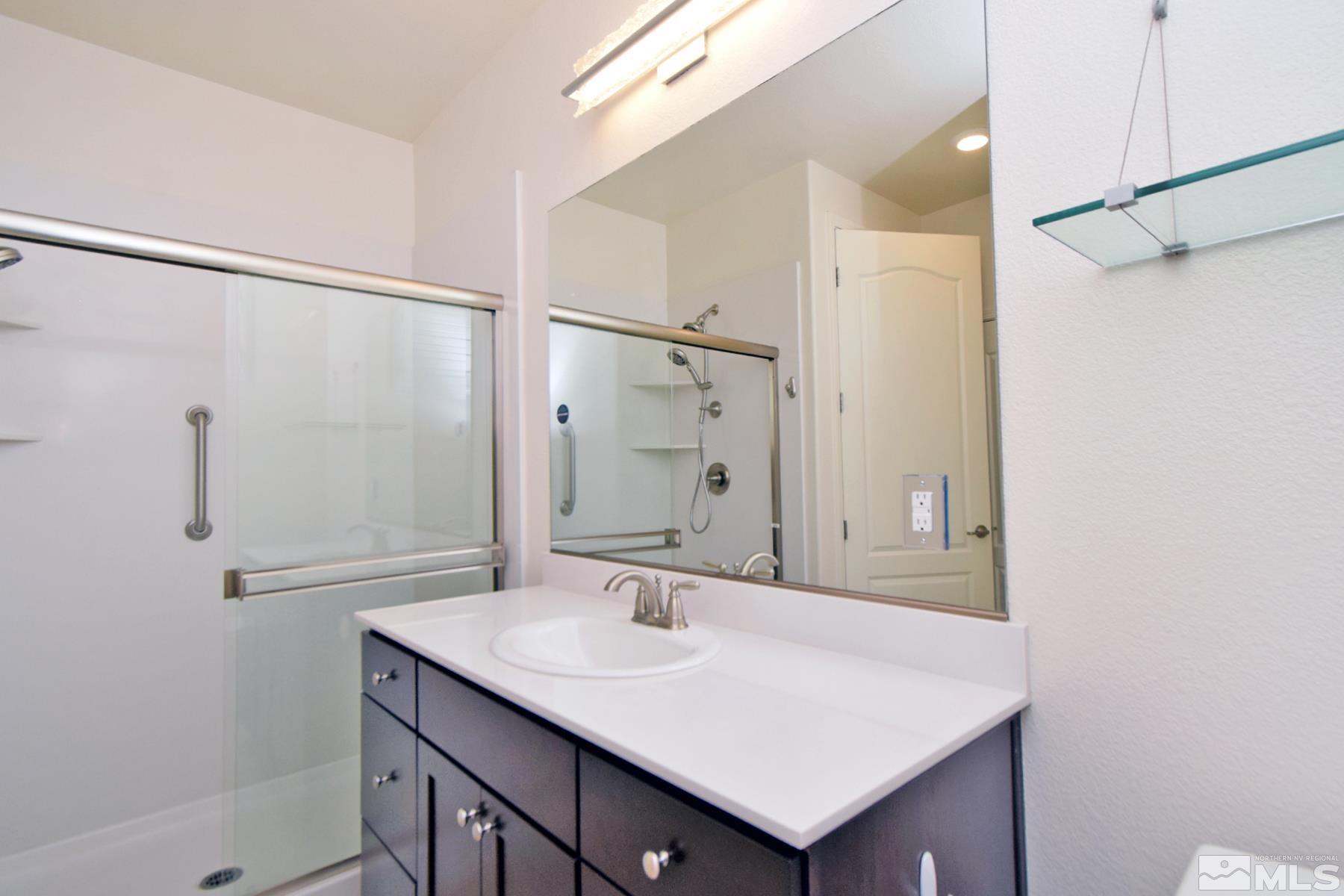 1630 Scott Valley Road Reno, NV 89523 - Photo 32 of 33 a bathroom with a sink and a mirror