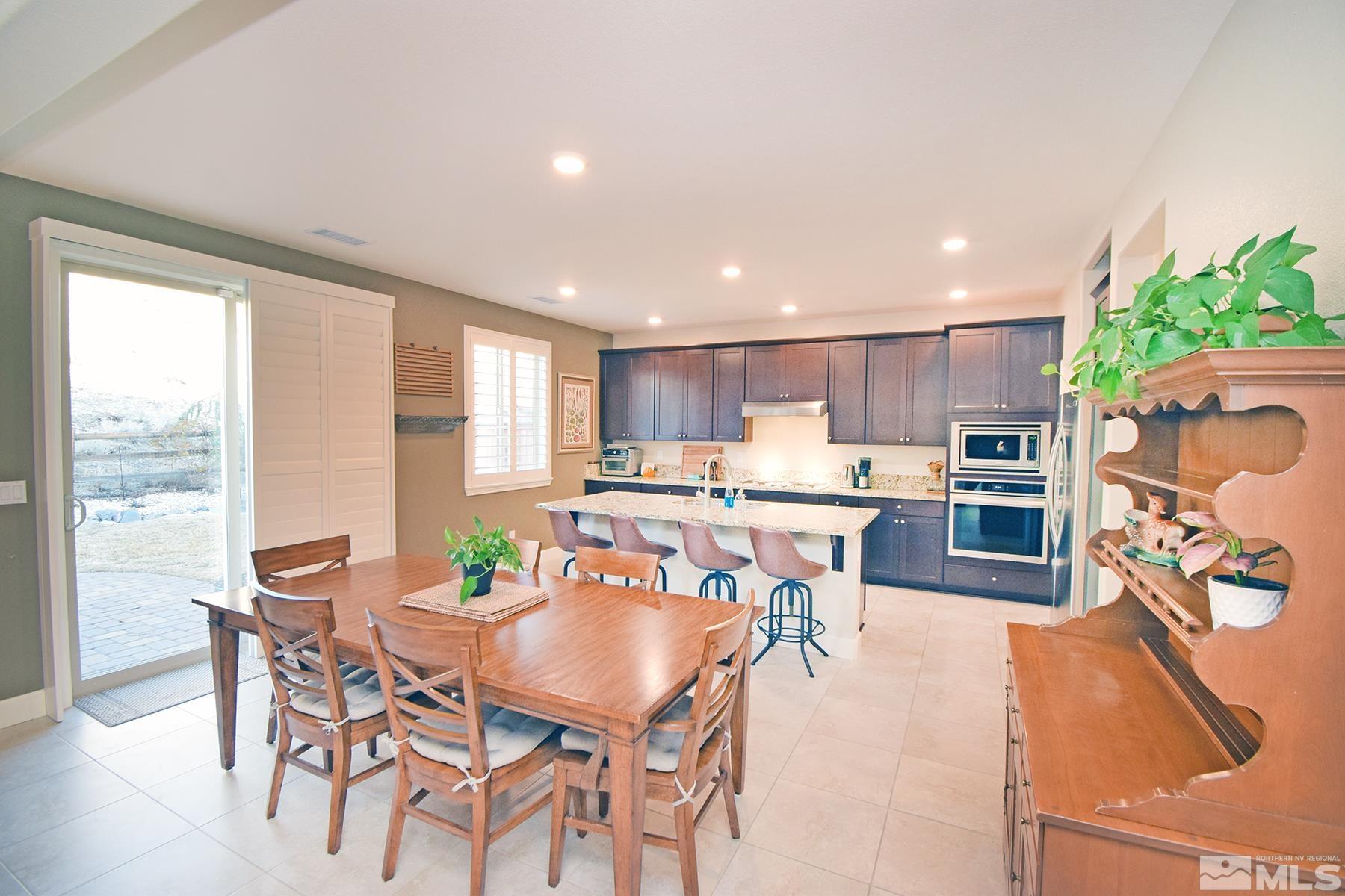 1630 Scott Valley Road Reno, NV 89523 - Photo 10 of 33 a view of a dining room with furniture and a kitchen