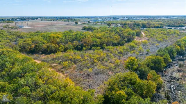 a view of a lake with houses in the back