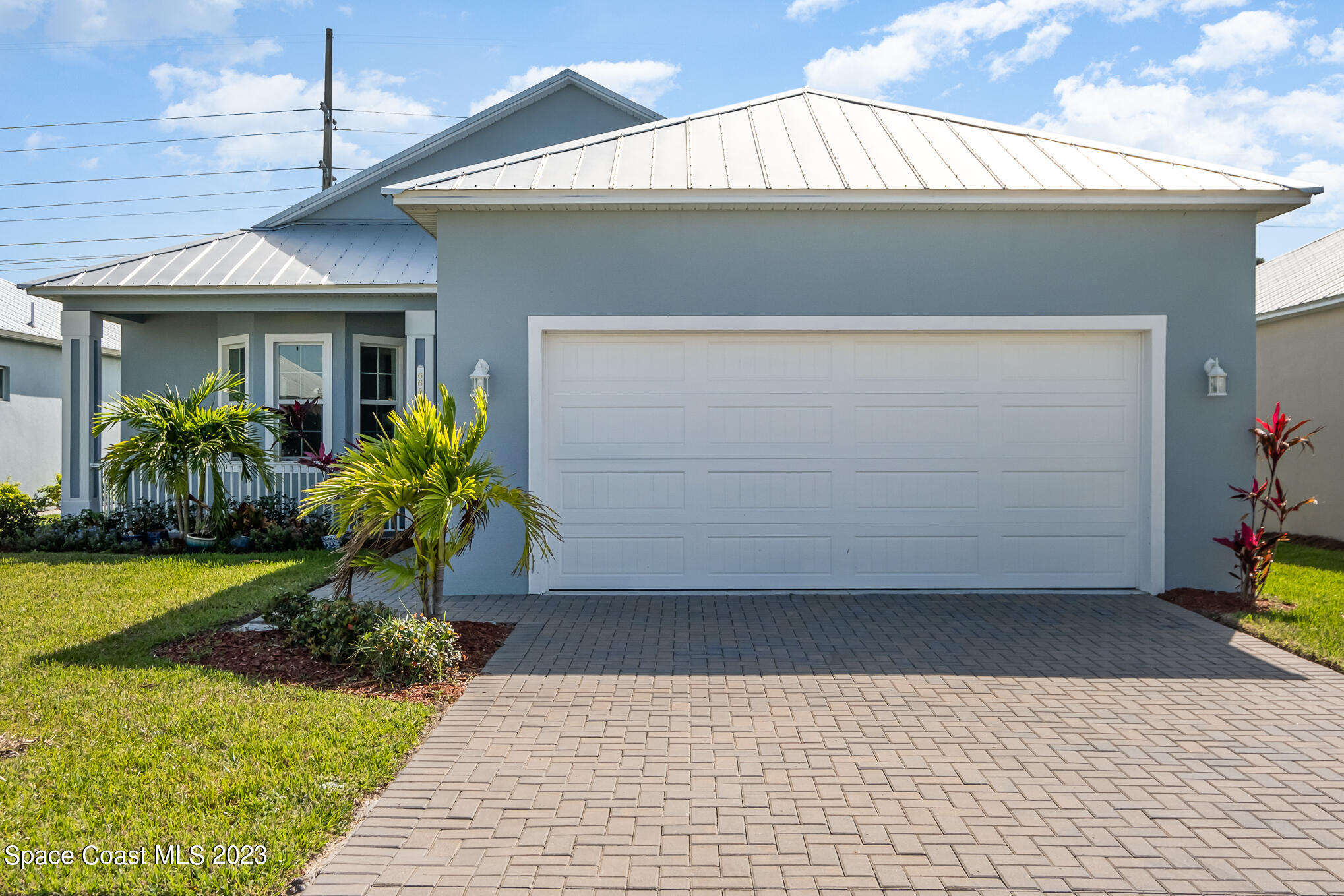 665 Lorelei Avenue Melbourne, FL 32901 - Photo 1 of 32 a view of a house with a small yard and plants