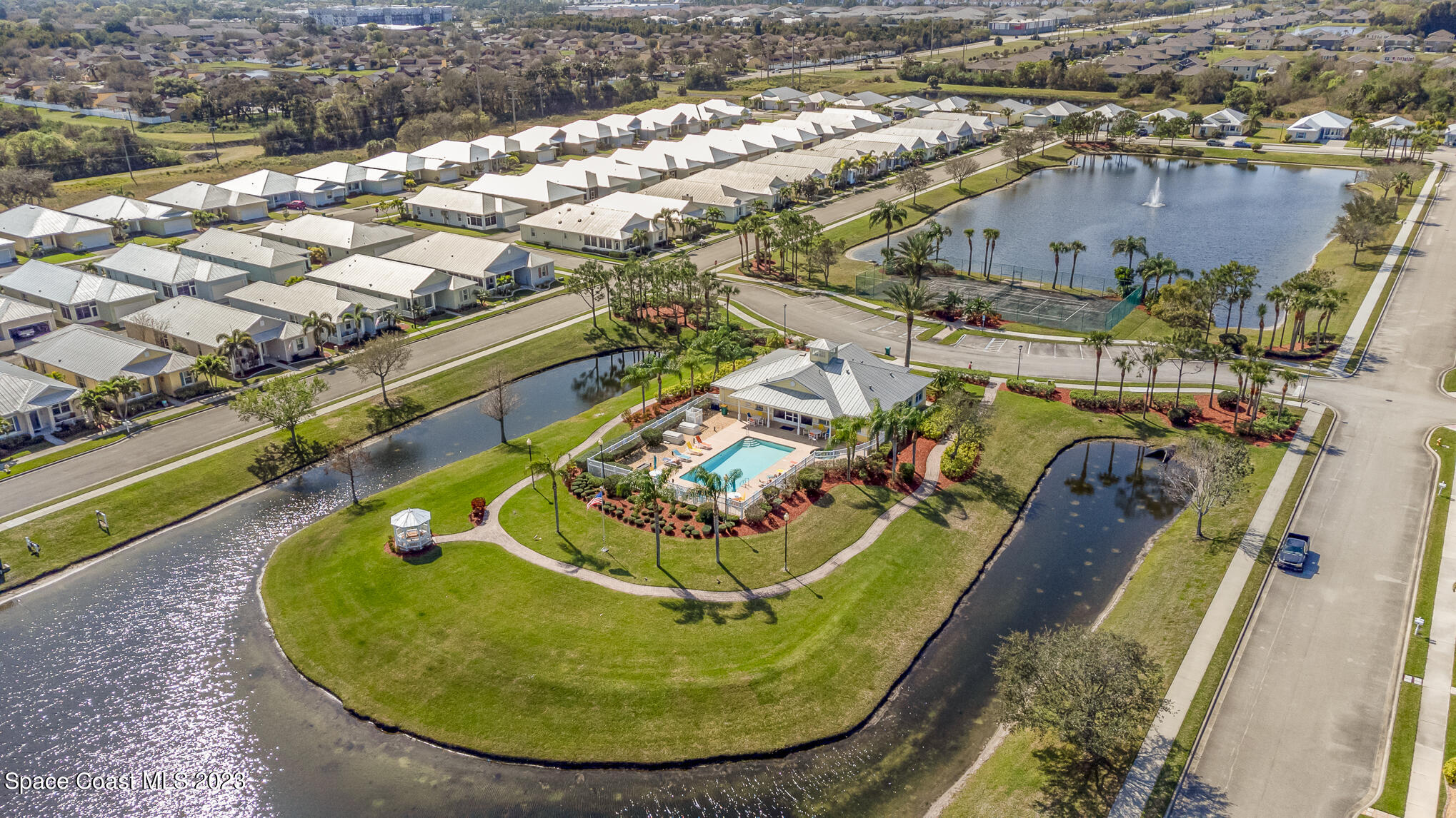 665 Lorelei Avenue Melbourne, FL 32901 - Photo 13 of 32 an aerial view of a swimming pool with a yard and seating