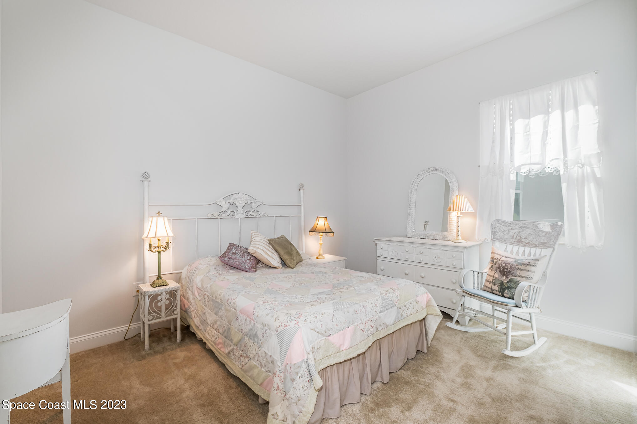 665 Lorelei Avenue Melbourne, FL 32901 - Photo 29 of 32 a bedroom with a bed and window