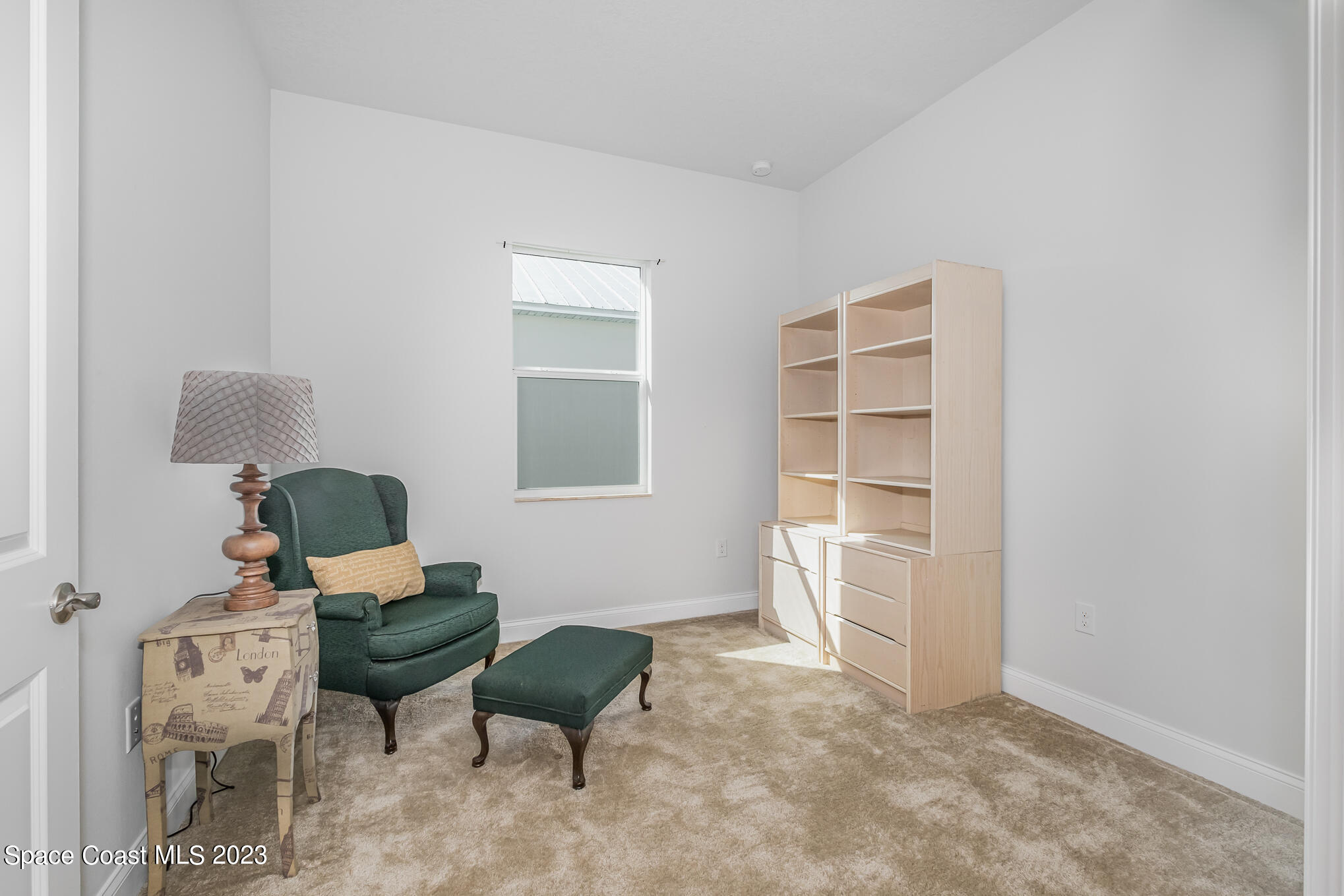 665 Lorelei Avenue Melbourne, FL 32901 - Photo 31 of 32 a living room with furniture and a window