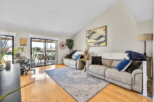 a view of a livingroom with furniture and a window
