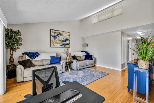 a dining room with furniture a rug and a fireplace
