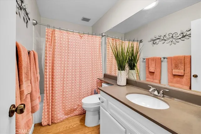 a view of a patio with table and chairs and potted plants