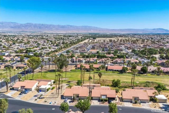 a view of a swimming pool with an outdoor space and seating area