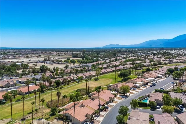 an aerial view of residential building and trees