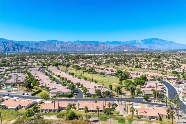 a view of a city with mountains in the background