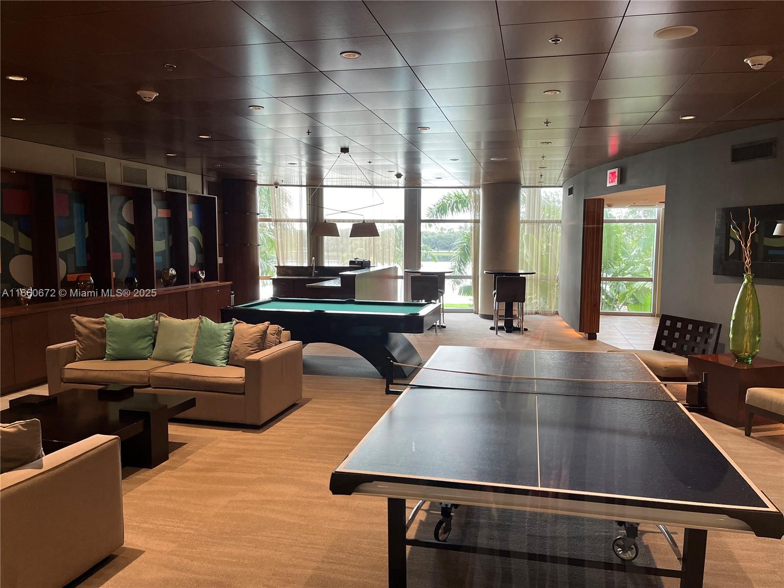 2681 North Flamingo Road, Unit 2108S Sunrise, FL 33323 - Photo 19 of 20 a living room with furniture and a large window