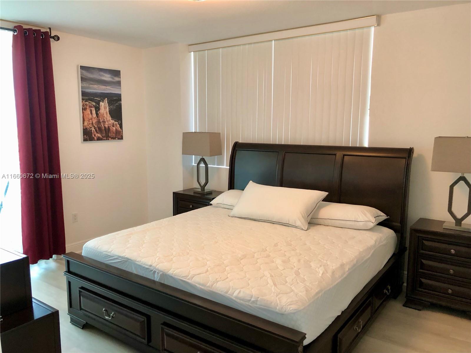 2681 North Flamingo Road, Unit 2108S Sunrise, FL 33323 - Photo 8 of 20 a bedroom with a bed and a dresser