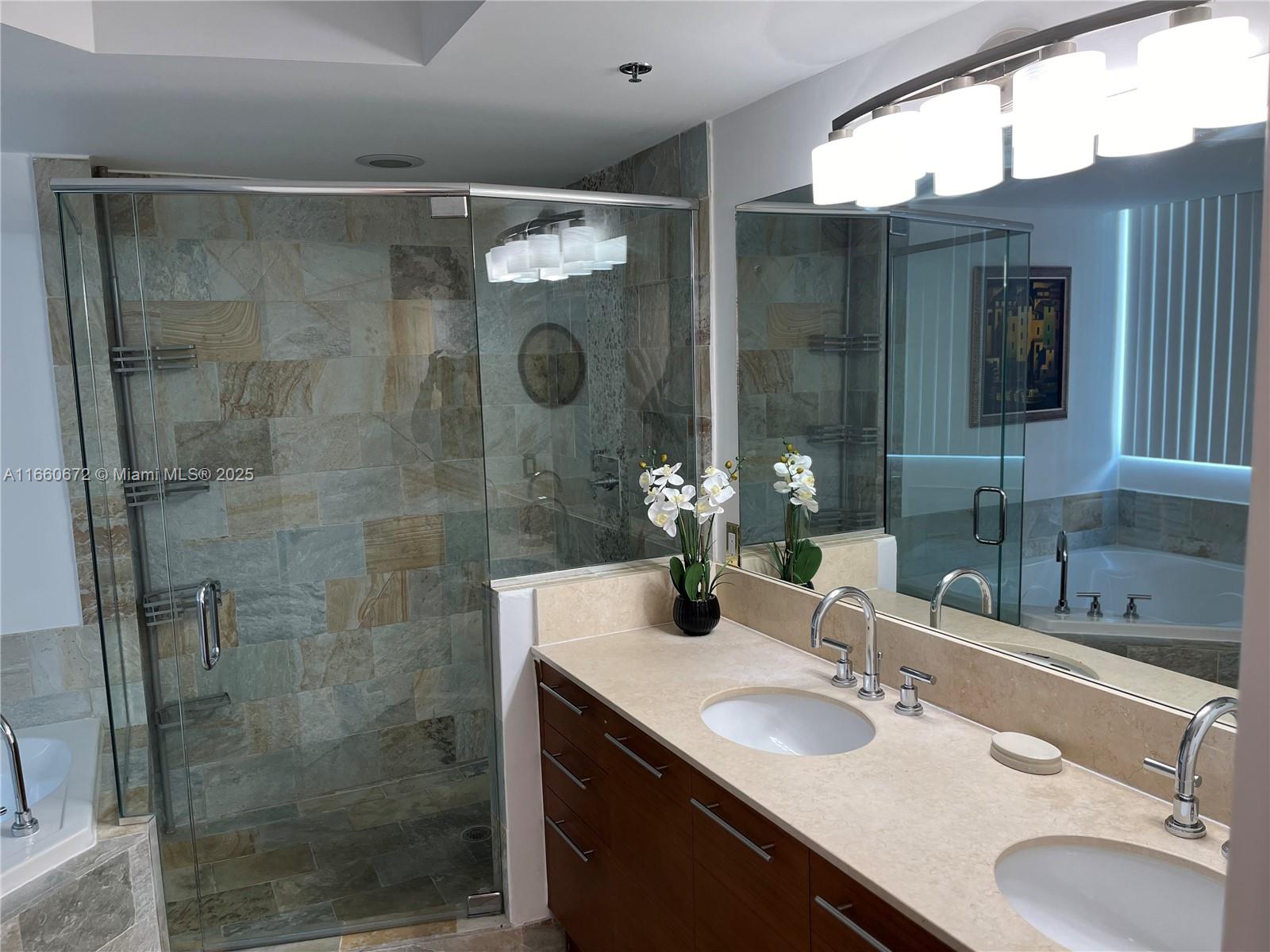 2681 North Flamingo Road, Unit 2108S Sunrise, FL 33323 - Photo 10 of 20 a bathroom with a sink shower and a mirror
