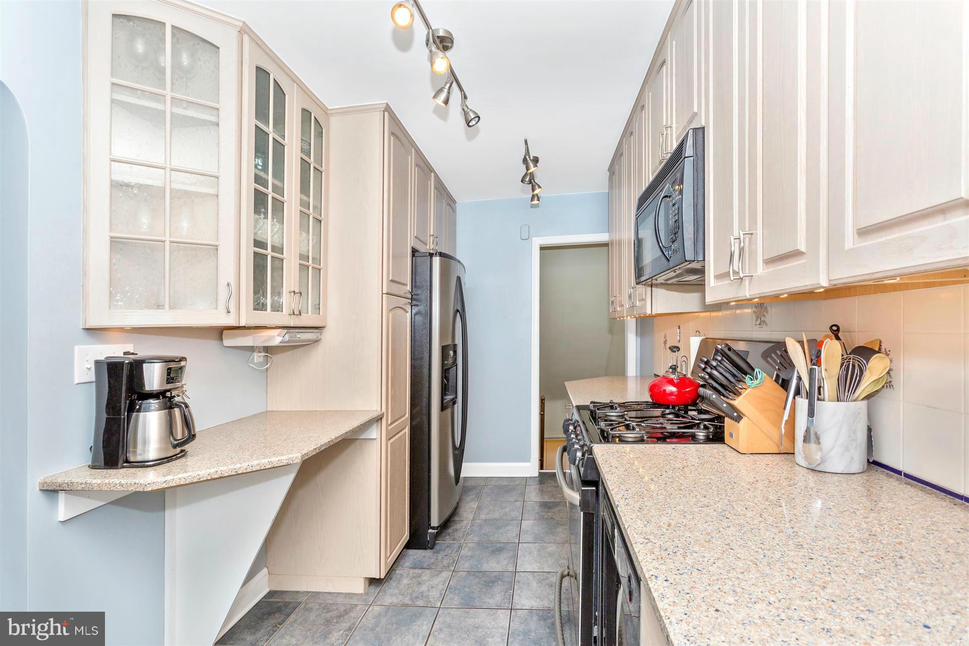 172 Stanmore Road Baltimore, MD 21212 - Photo 15 of 30 a kitchen with stainless steel appliances granite countertop a refrigerator and a sink