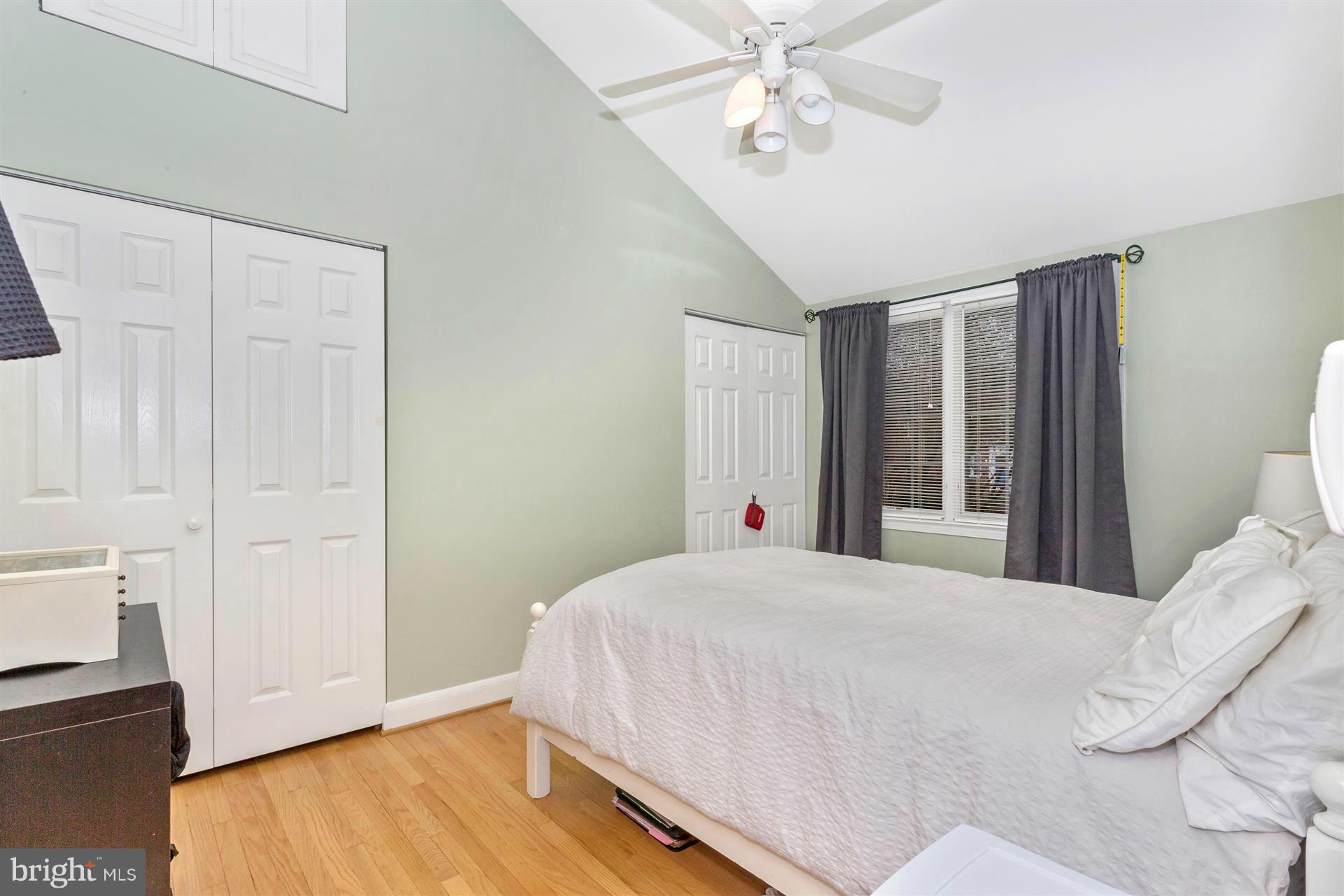 172 Stanmore Road Baltimore, MD 21212 - Photo 17 of 30 a bedroom with a large bed and a chandelier