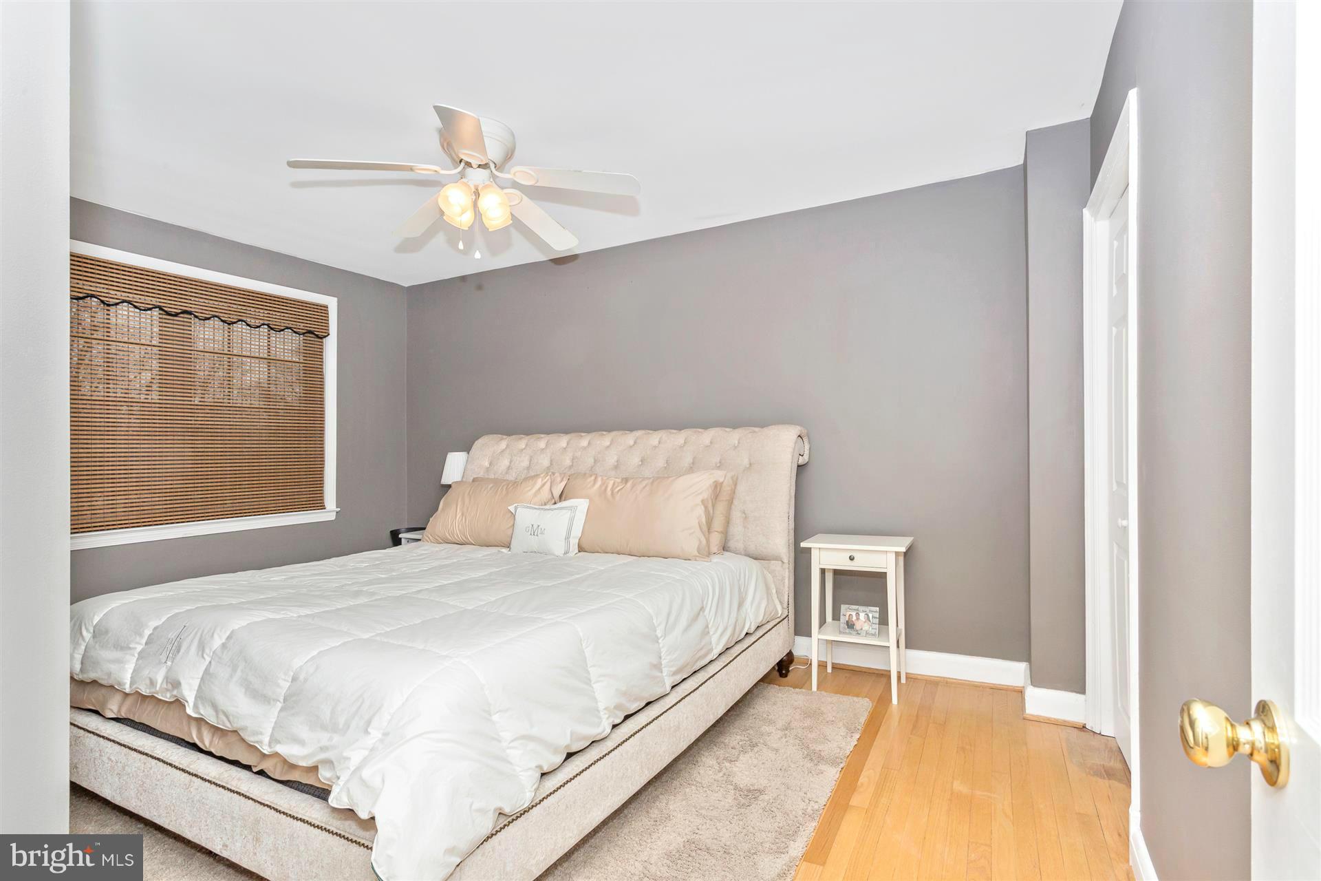 172 Stanmore Road Baltimore, MD 21212 - Photo 20 of 30 a large bed sitting in a bedroom next to a window