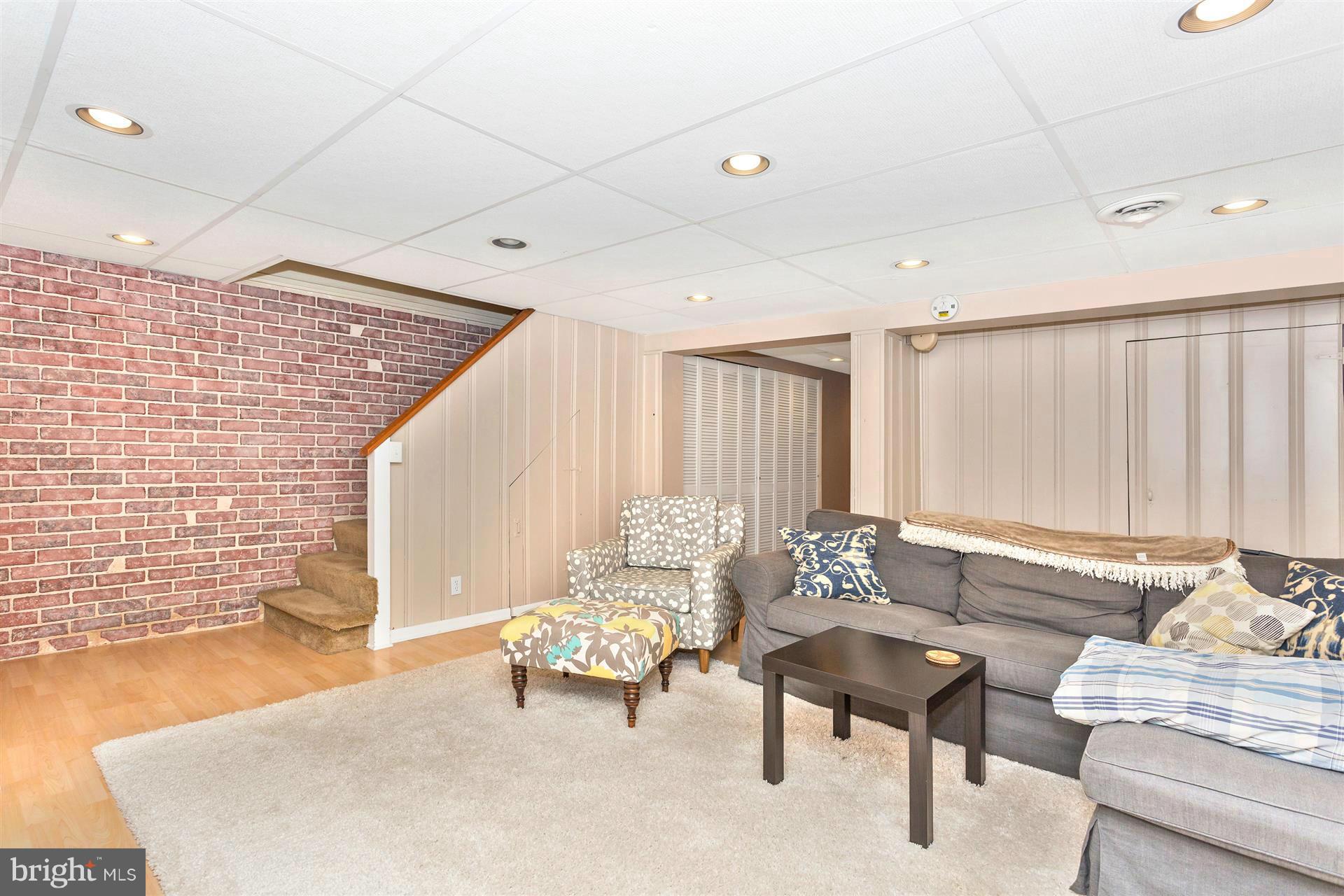 172 Stanmore Road Baltimore, MD 21212 - Photo 23 of 30 a living room with furniture and a large window