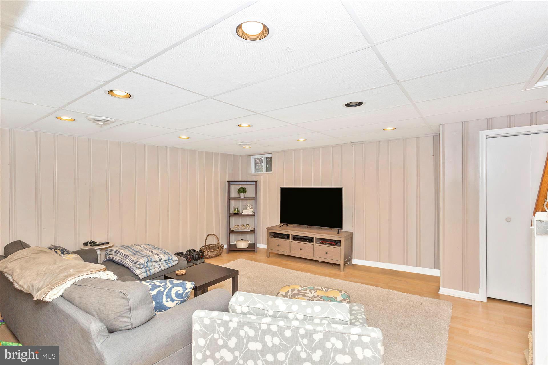172 Stanmore Road Baltimore, MD 21212 - Photo 24 of 30 a living room with furniture and a flat screen tv