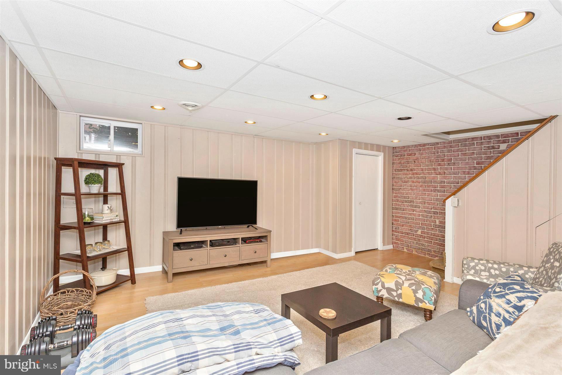 172 Stanmore Road Baltimore, MD 21212 - Photo 25 of 30 a living room with furniture and a flat screen tv