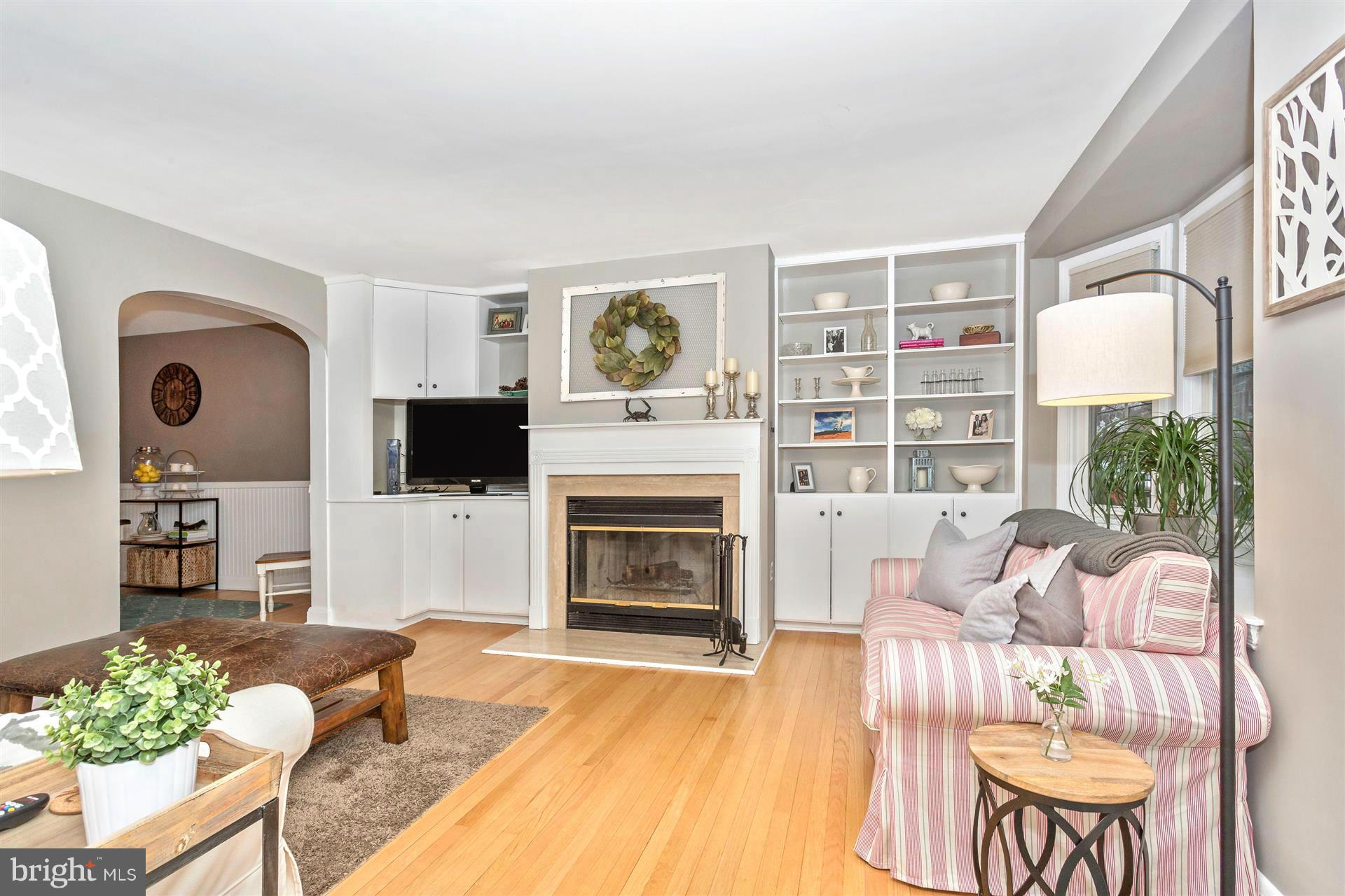 172 Stanmore Road Baltimore, MD 21212 - Photo 6 of 30 a living room with furniture a flat screen tv and a fireplace