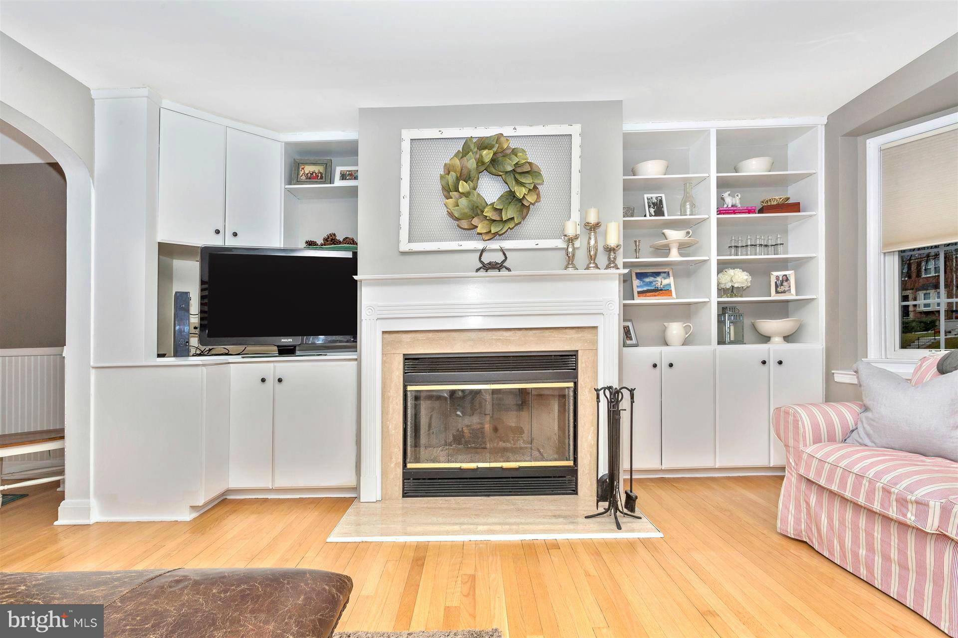 172 Stanmore Road Baltimore, MD 21212 - Photo 8 of 30 a living room with furniture a flat screen tv and a fireplace