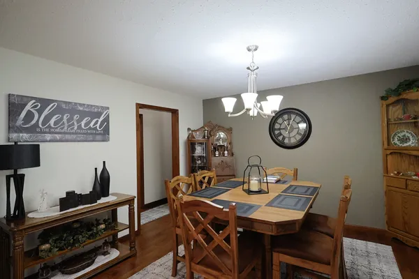 a dining room with furniture and window