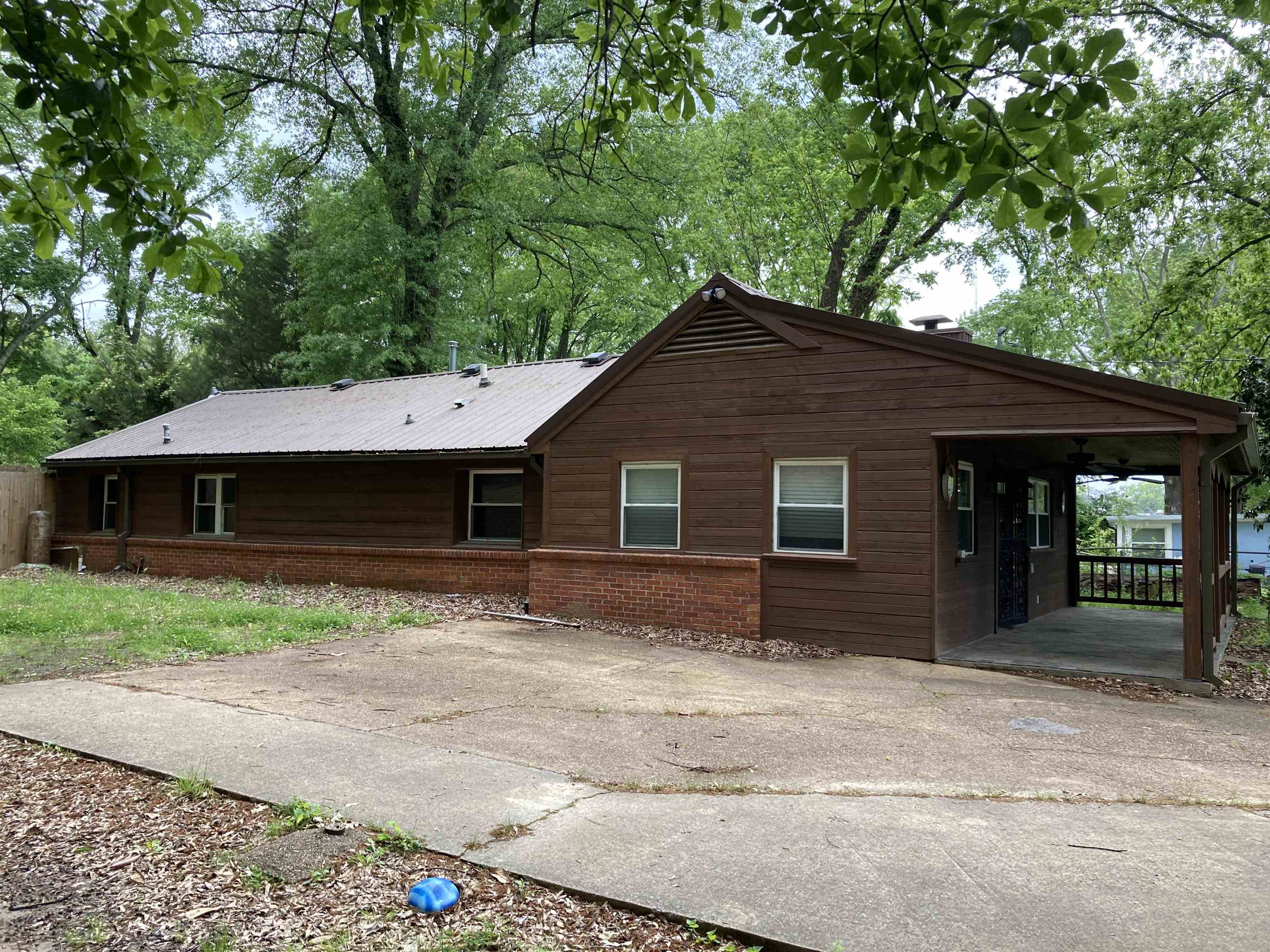 6403 Patmore Road Memphis, TN 38134 - Photo 1 of 8 a house with a tree in front of it