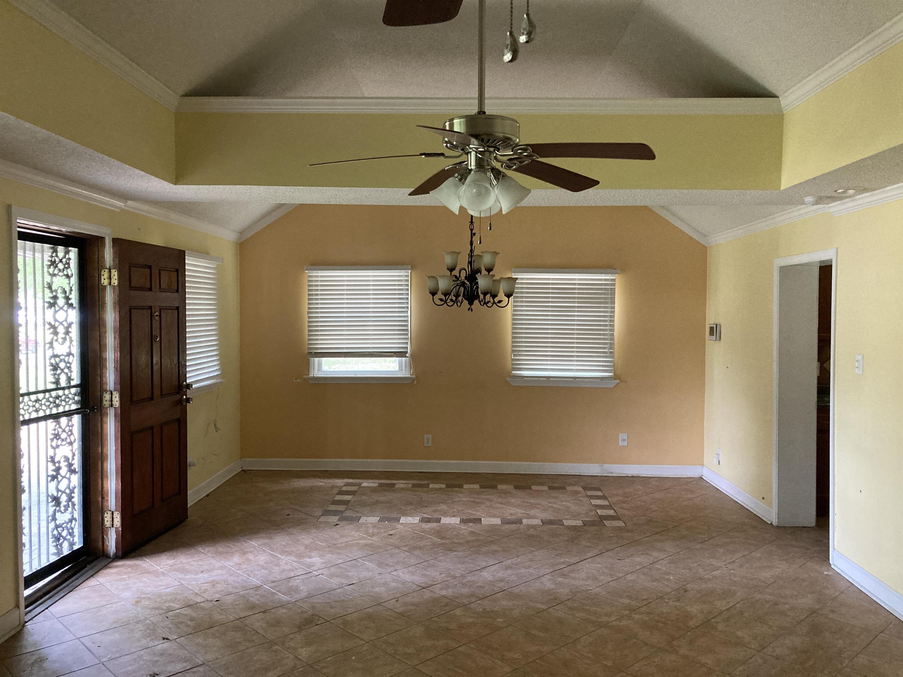6403 Patmore Road Memphis, TN 38134 - Photo 2 of 8 a view of a livingroom with a ceiling fan and window