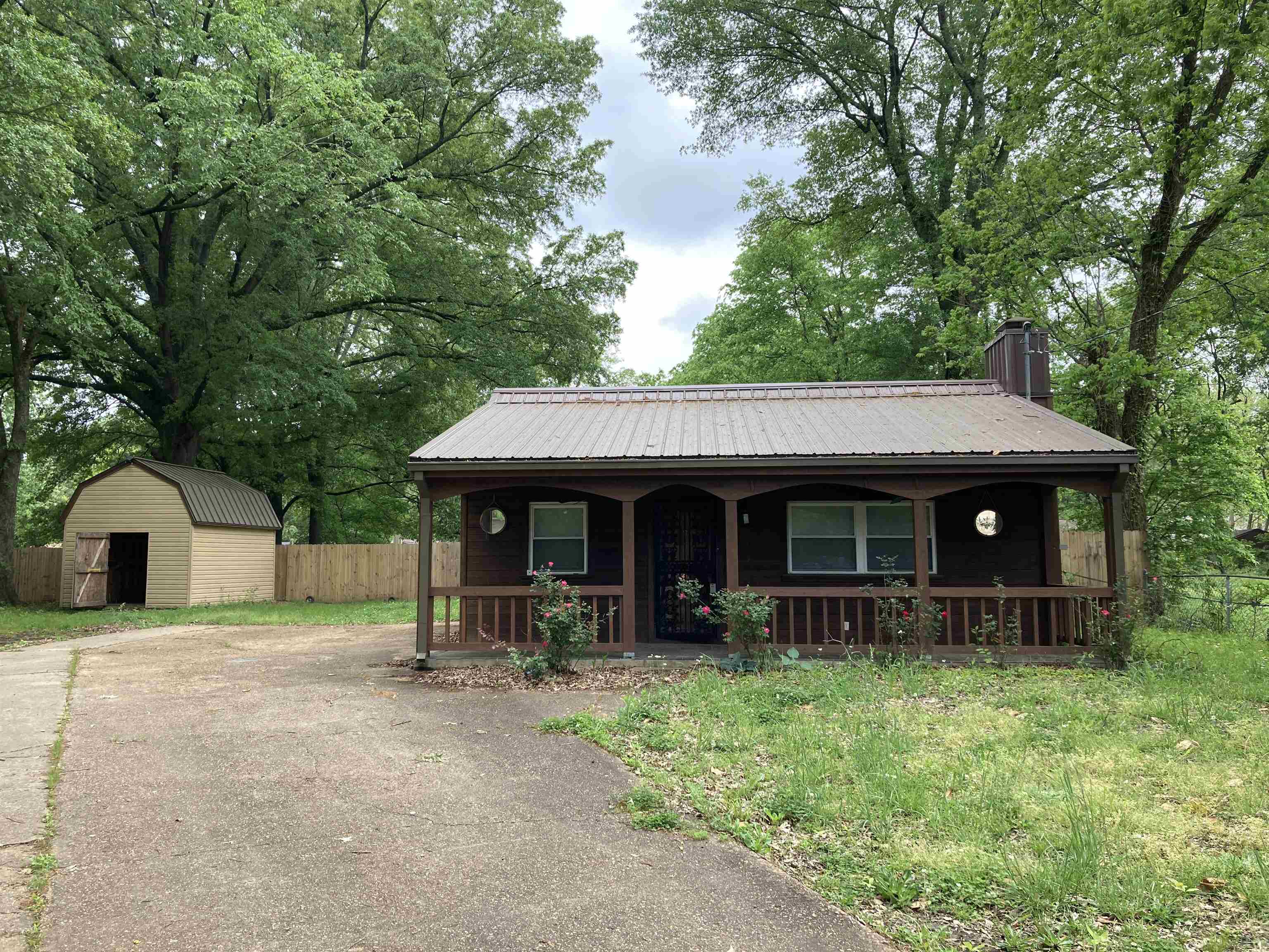 6403 Patmore Road Memphis, TN 38134 - Photo 8 of 8 a view of a house with a yard and large tree