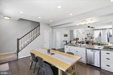 a kitchen with sink and cabinets