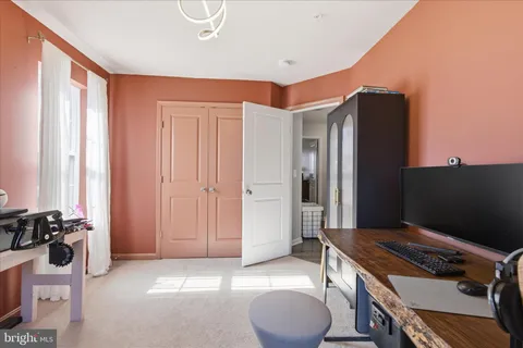 a workspace with furniture and window