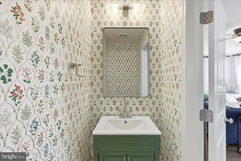 a bathroom with a sink and a mirror