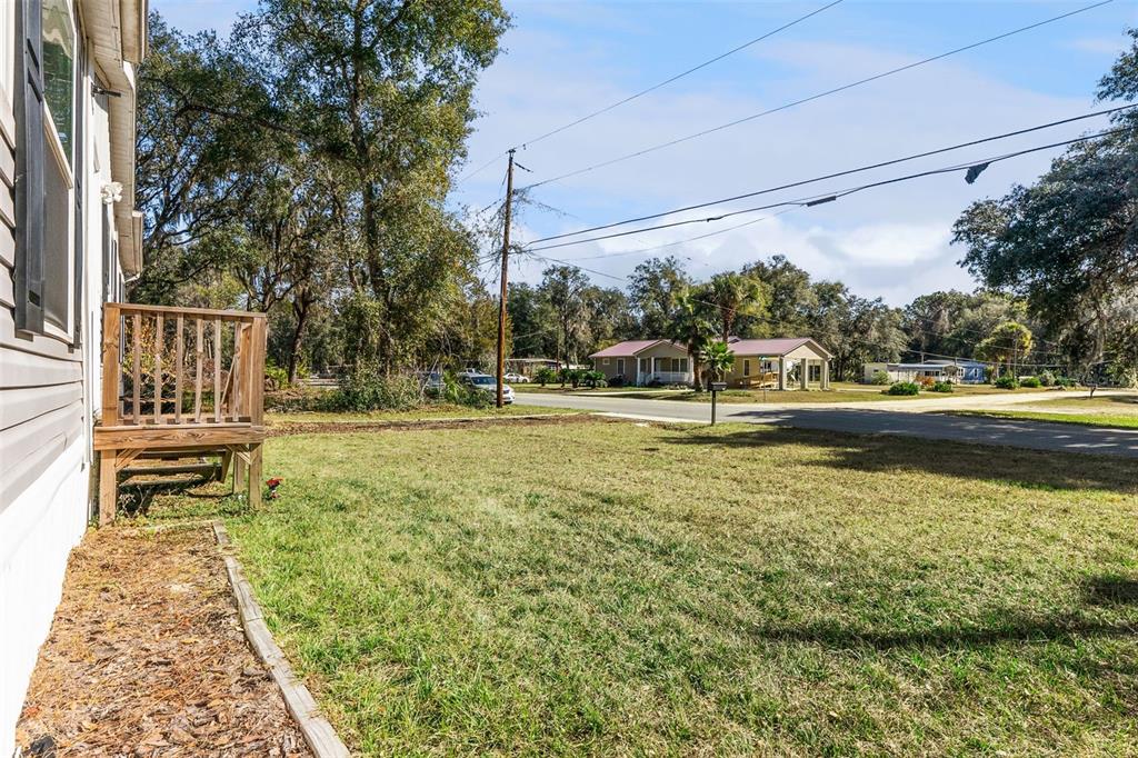 231 Tropic Avenue Satsuma, FL 32189 - Photo 21 of 28 a swimming pool with barbeque and outdoor seating