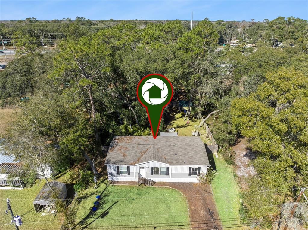 231 Tropic Avenue Satsuma, FL 32189 - Photo 26 of 28 a aerial view of a house with a yard basket ball court and outdoor seating