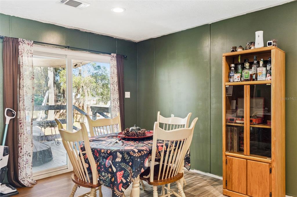 231 Tropic Avenue Satsuma, FL 32189 - Photo 4 of 28 a view of a dining room with furniture window and outside view