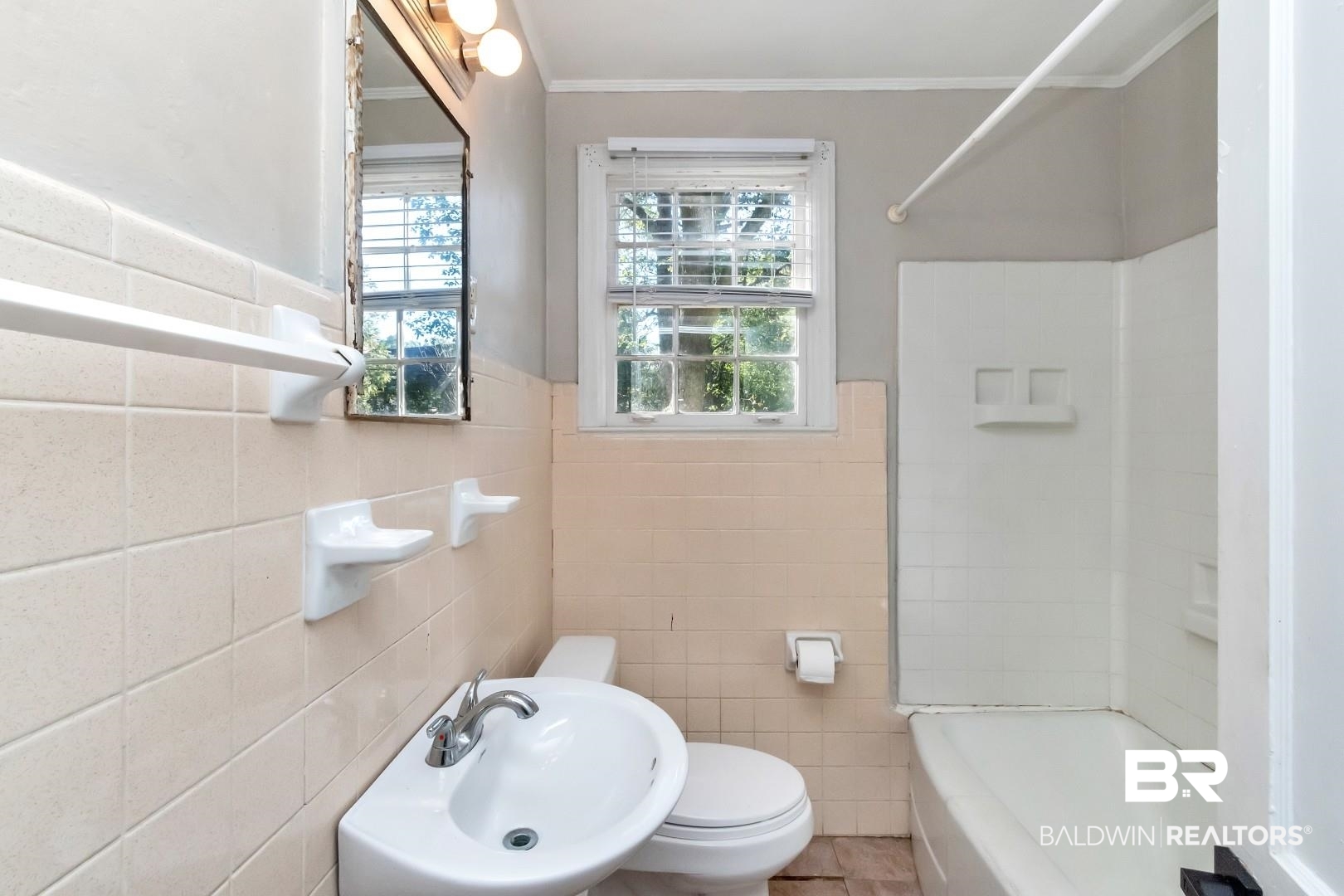 5001 Hillwood Circle South Mobile, AL 36608 - Photo 16 of 20 Bathroom featuring tile walls, toilet, ornamental molding, a sink, and shower / tub combination