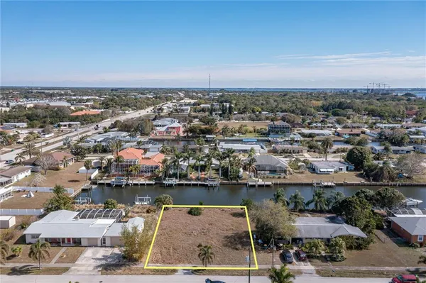 an aerial view of a house with a lake view