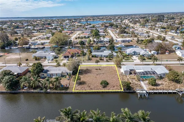 an aerial view of residential houses with ocean view
