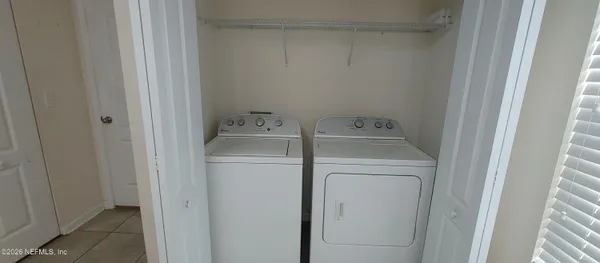 a utility room with dryer and washer