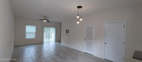 a view of empty room with windows