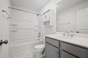 a bathroom with a sink a toilet and a bathtub