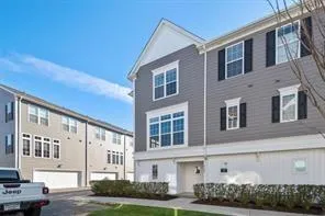 a front view of a building with garden