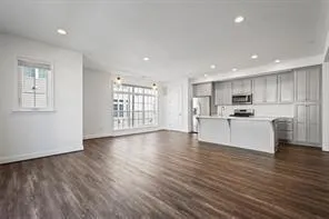 a view of kitchen with cabinets and wooden floor