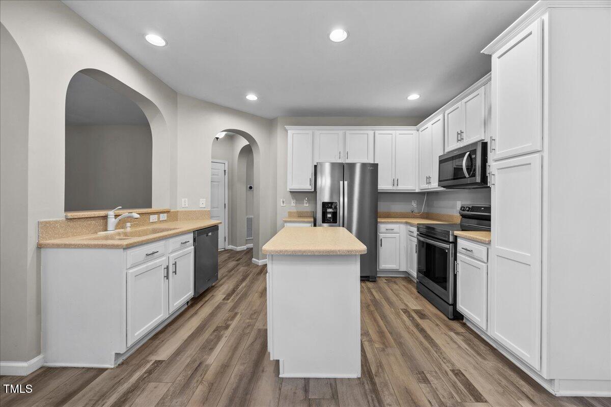 8404 Split Stone Lane Raleigh, NC 27613 - Photo 11 of 45 a kitchen with a sink appliances and cabinets
