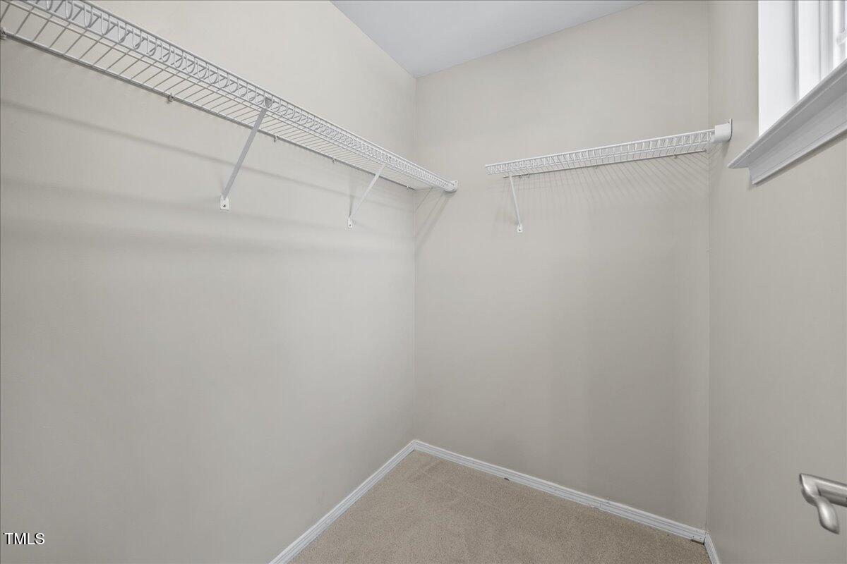8404 Split Stone Lane Raleigh, NC 27613 - Photo 33 of 45 a view of a room with racks on the wall