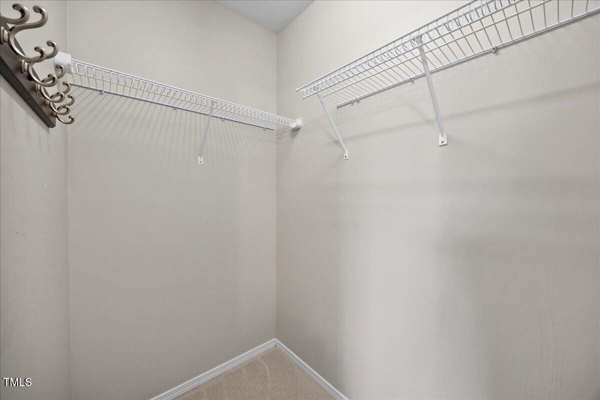 8404 Split Stone Lane Raleigh, NC 27613 - Photo 35 of 45 a view of a room with racks on the wall