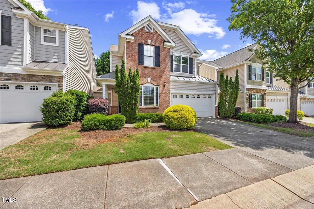 8404 Split Stone Lane Raleigh, NC 27613 - Photo 3 of 45 a front view of a house with garden