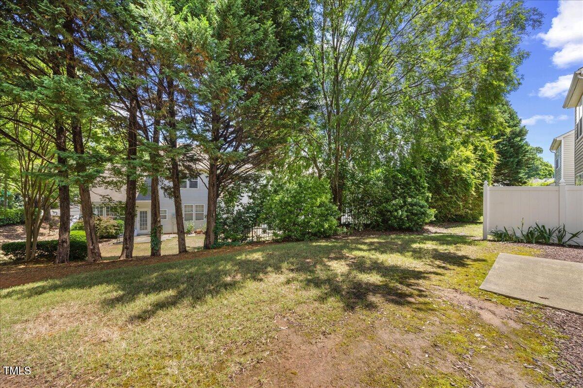 8404 Split Stone Lane Raleigh, NC 27613 - Photo 40 of 45 a view of a yard with a tree